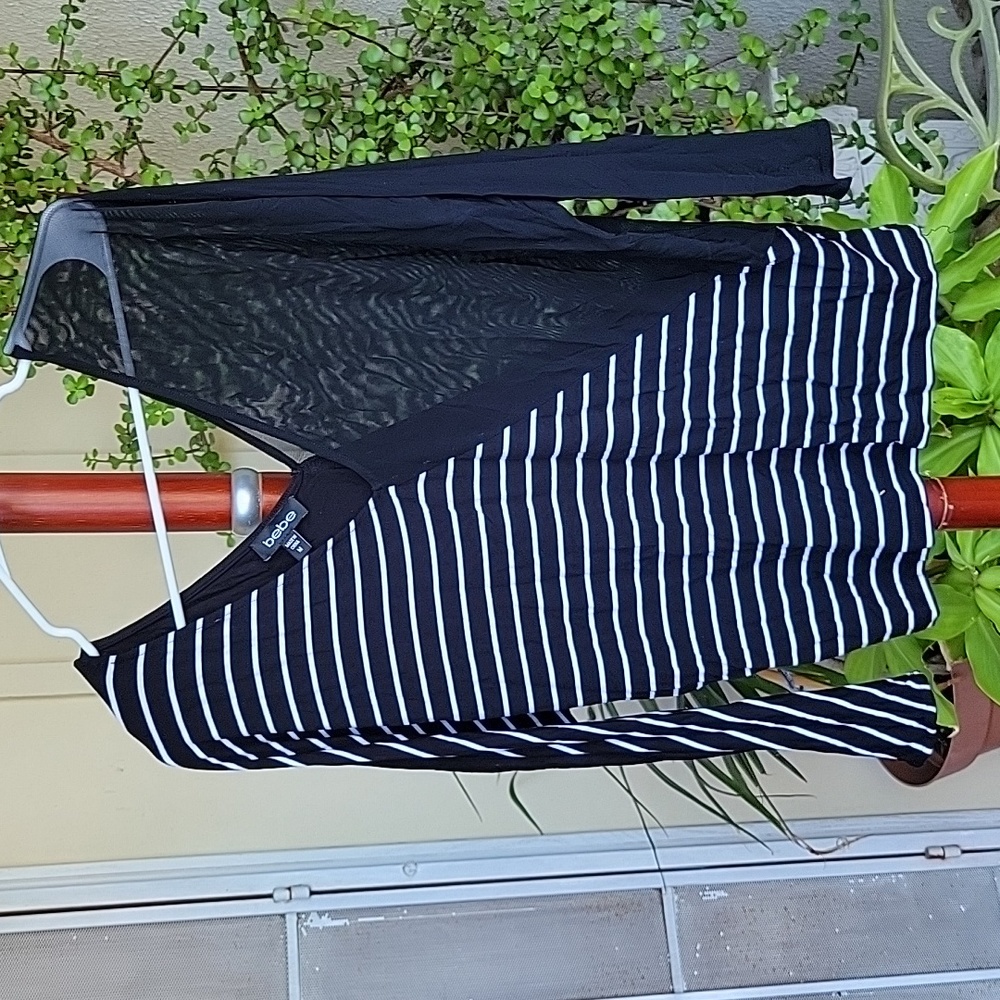 Bebe blouse. Size M. Color black and white.